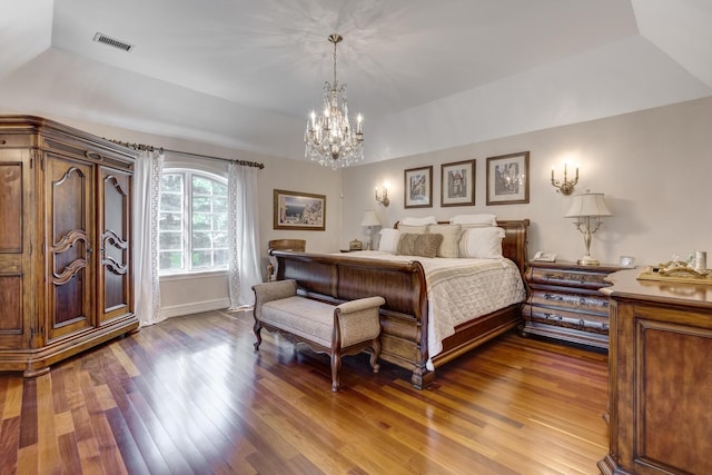 220 Elderfields Rd, Manhasset, NY 11030 - bedroom with wood finished floors, a chandelier, vaulted ceiling, and baseboards