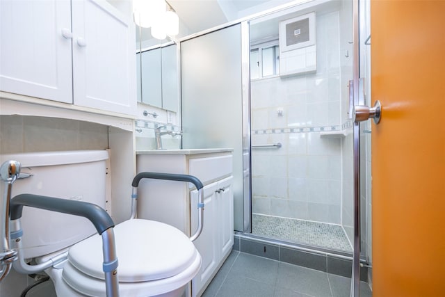 215 Park Row Unit 8B, New York Manhattan, NY 10038 - bathroom featuring toilet, a stall shower, tile patterned floors, and vanity