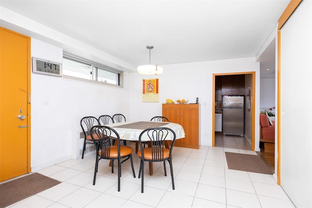 215 Park Row Unit 8B, New York Manhattan, NY 10038 - dining room featuring light tile patterned flooring and baseboards