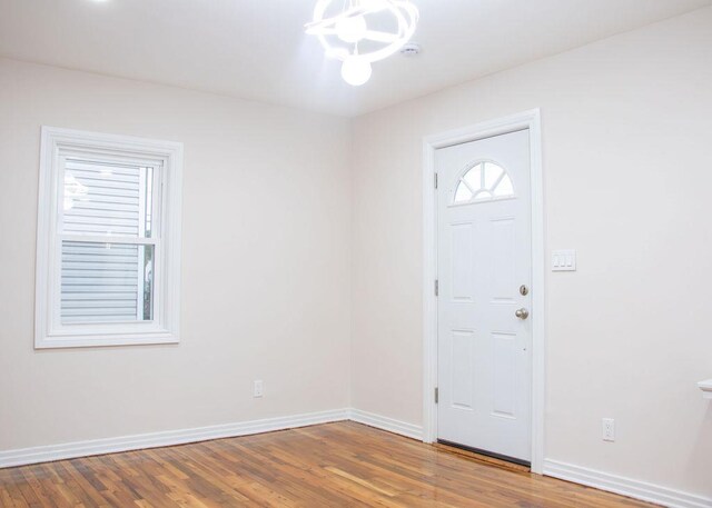11 Shine Pl, Valley Stream, NY 11581 - foyer entrance featuring a chandelier, wood finished floors, and baseboards