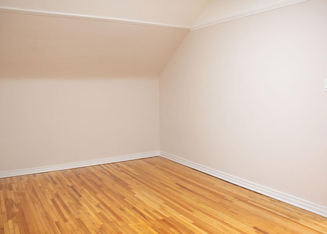11 Shine Pl, Valley Stream, NY 11581 - bonus room featuring vaulted ceiling, light wood-type flooring, and baseboards