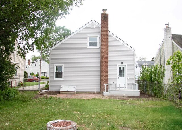 11 Shine Pl, Valley Stream, NY 11581 - rear view of house featuring a chimney