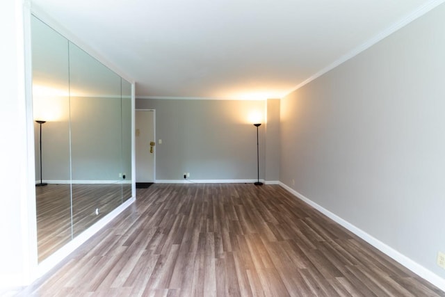 240 Garth Rd Unit 2G2, Scarsdale, NY 10583 - spare room featuring wood finished floors, ornamental molding, and baseboards