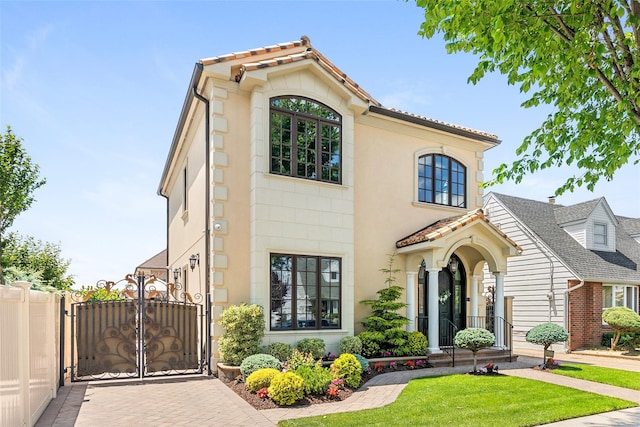 158-44 87th St, Howard Beach, NY 11414 - mediterranean / spanish house with a gate