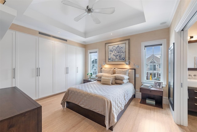 158-44 87th St, Howard Beach, NY 11414 - bedroom featuring a raised ceiling, light wood-style flooring, multiple windows, a closet, and recessed lighting