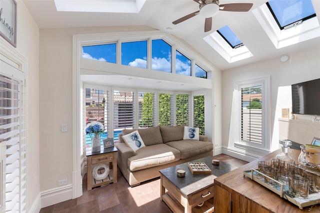 158-44 87th St, Howard Beach, NY 11414 - living area featuring a skylight, a ceiling fan, vaulted ceiling, and baseboards