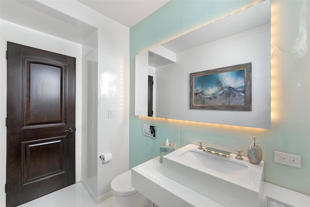 158-44 87th St, Howard Beach, NY 11414 - bathroom featuring toilet, baseboards, and a sink