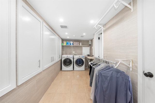 158-44 87th St, Howard Beach, NY 11414 - laundry room with independent washer and dryer, tile walls, light tile patterned flooring, and recessed lighting