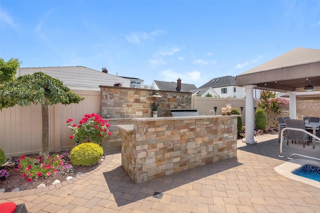 158-44 87th St, Howard Beach, NY 11414 - fenced backyard with an outdoor kitchen, a patio, a ceiling fan, and outdoor dining space