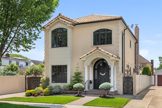 158-44 87th St, Howard Beach, NY 11414 - mediterranean / spanish-style house featuring a tiled roof, stucco siding, a garage, and driveway
