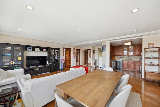 99-31 66th Ave Unit 5A, Rego Park, NY 11374 - dining space with recessed lighting, light wood-style flooring, wet bar, and crown molding