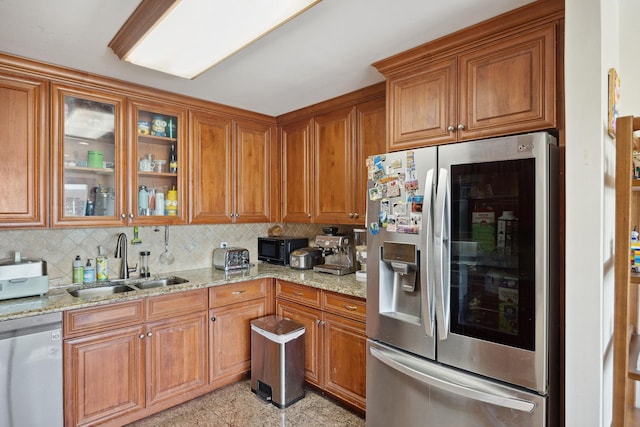 99-31 66th Ave Unit 5A, Rego Park, NY 11374 - kitchen with appliances with stainless steel finishes, a sink, and brown cabinets