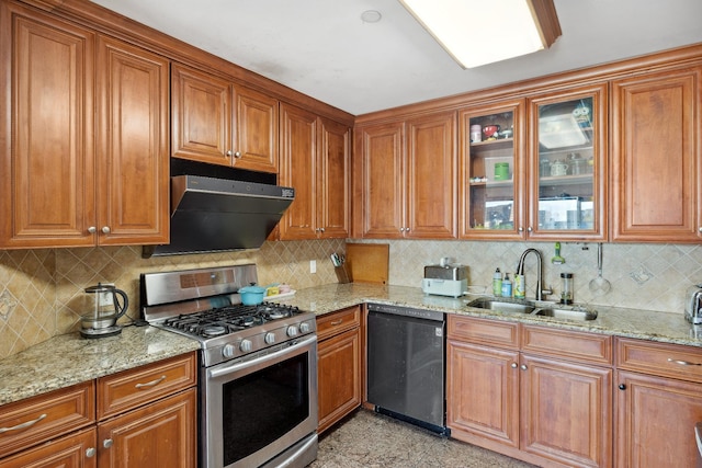 99-31 66th Ave Unit 5A, Rego Park, NY 11374 - kitchen featuring stainless steel gas range, dishwashing machine, a sink, under cabinet range hood, and brown cabinets