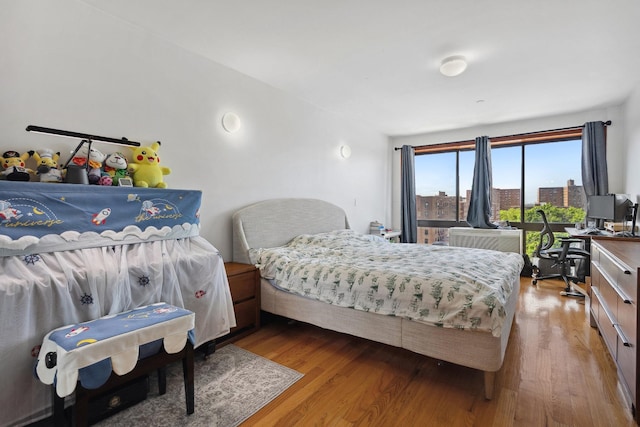 99-31 66th Ave Unit 5A, Rego Park, NY 11374 - bedroom featuring wood finished floors
