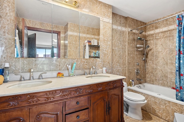 99-31 66th Ave Unit 5A, Rego Park, NY 11374 - full bath featuring tile walls, tiled shower / bath combo, double vanity, toilet, and tile patterned floors