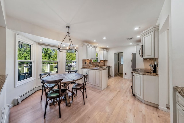 20 Vineyard Way, Mount Sinai, NY 11766 - dining room with light wood finished floors, recessed lighting, a baseboard heating unit, baseboards, and a chandelier