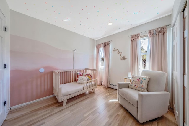 20 Vineyard Way, Mount Sinai, NY 11766 - bedroom with light wood-style floors, a baseboard radiator, and recessed lighting