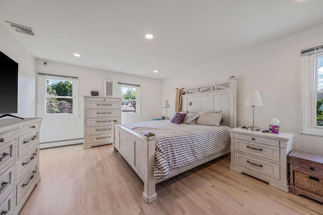 20 Vineyard Way, Mount Sinai, NY 11766 - bedroom with baseboard heating, light wood-style flooring, and recessed lighting