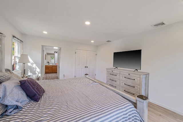 20 Vineyard Way, Mount Sinai, NY 11766 - bedroom featuring light wood finished floors, recessed lighting, baseboards, and ensuite bath