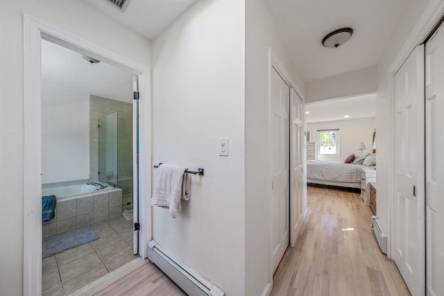 20 Vineyard Way, Mount Sinai, NY 11766 - full bathroom with baseboard heating, a bath, connected bathroom, and a stall shower