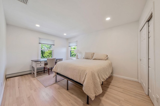 20 Vineyard Way, Mount Sinai, NY 11766 - bedroom with light wood-style floors, recessed lighting, a closet, a baseboard radiator, and baseboards
