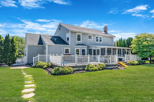 20 Vineyard Way, Mount Sinai, NY 11766 - back of property featuring a sunroom, a chimney, a yard, and a wooden deck
