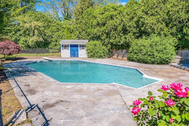 20 Vineyard Way, Mount Sinai, NY 11766 - view of swimming pool with a fenced backyard, a patio area, an outbuilding, and a diving board