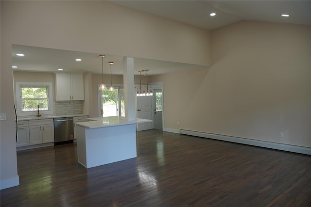 352 Bay Ave, Patchogue, NY 11772 - kitchen with stainless steel dishwasher, a sink, white cabinets, dark wood-style flooring, and light countertops