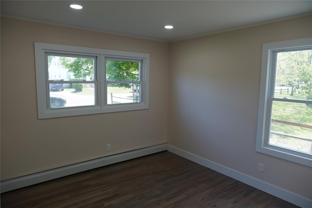 352 Bay Ave, Patchogue, NY 11772 - empty room featuring a baseboard heating unit, dark wood finished floors, ornamental molding, baseboards, and recessed lighting