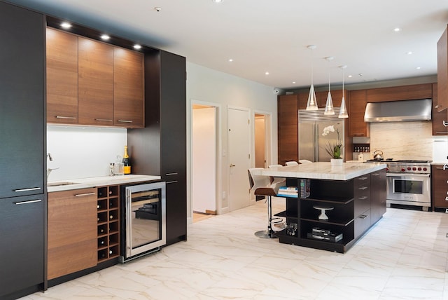 43 Random Farms Cir, Chappaqua, NY 10514 - kitchen with high end appliances, wine cooler, wall chimney exhaust hood, light marble finish floors, and tasteful backsplash