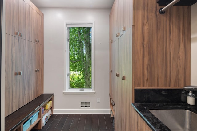 43 Random Farms Cir, Chappaqua, NY 10514 - mudroom featuring baseboards and dark wood finished floors