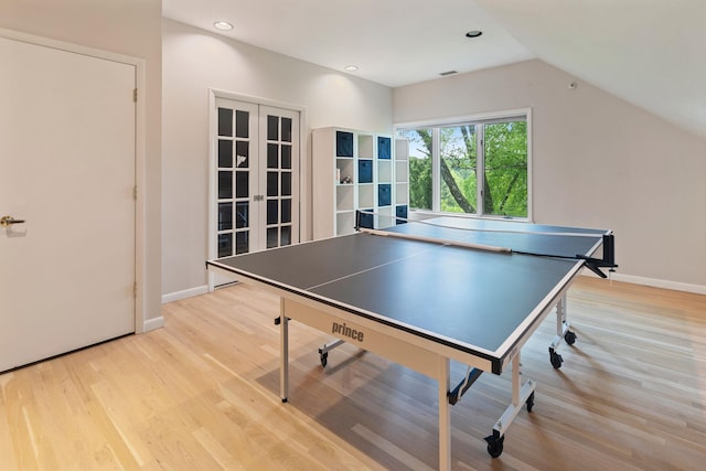 43 Random Farms Cir, Chappaqua, NY 10514 - playroom with light wood-style floors, french doors, lofted ceiling, and recessed lighting