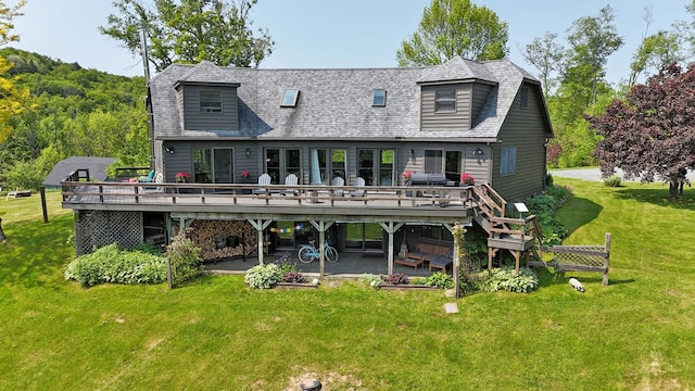 605 Dutch Hill Rd, Call Listing Agent, NY 12776 - back of property featuring a deck and a lawn