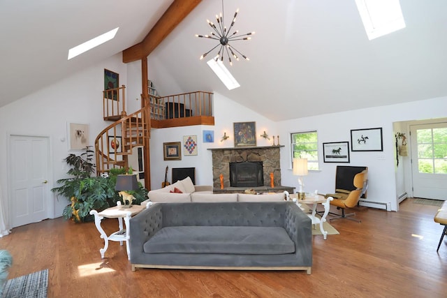 605 Dutch Hill Rd, Call Listing Agent, NY 12776 - living room featuring a skylight, high vaulted ceiling, stairway, a fireplace, and wood finished floors