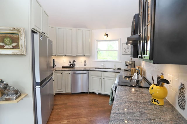 605 Dutch Hill Rd, Call Listing Agent, NY 12776 - kitchen featuring appliances with stainless steel finishes, a sink, decorative backsplash, and dark stone counters