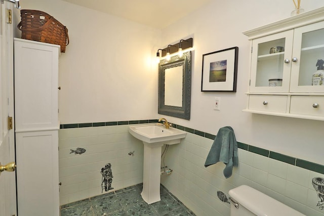 605 Dutch Hill Rd, Call Listing Agent, NY 12776 - half bathroom with toilet, tile walls, and a wainscoted wall