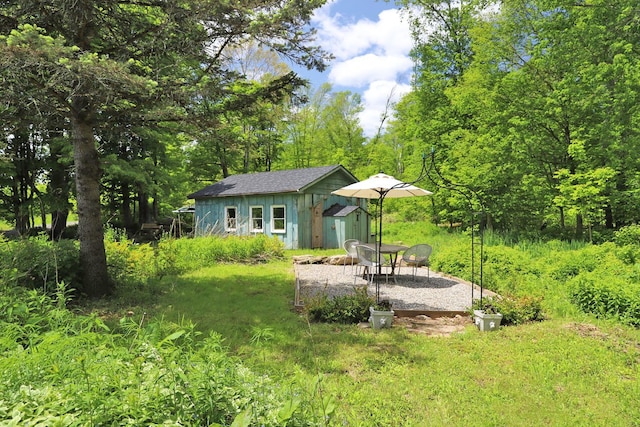 605 Dutch Hill Rd, Call Listing Agent, NY 12776 - view of yard with an outdoor structure and a patio area