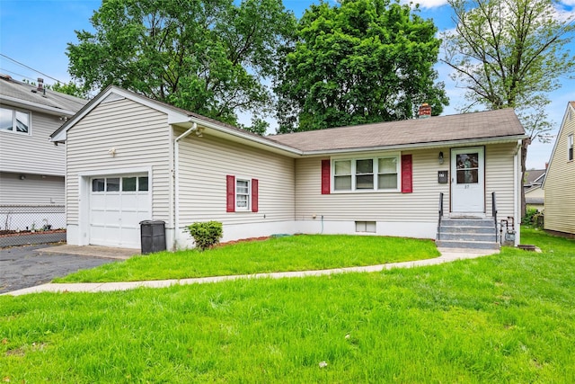 37 Prospect St, Garnerville, NY 10923 - view of front of home with an attached garage, driveway, a front yard, and a chimney