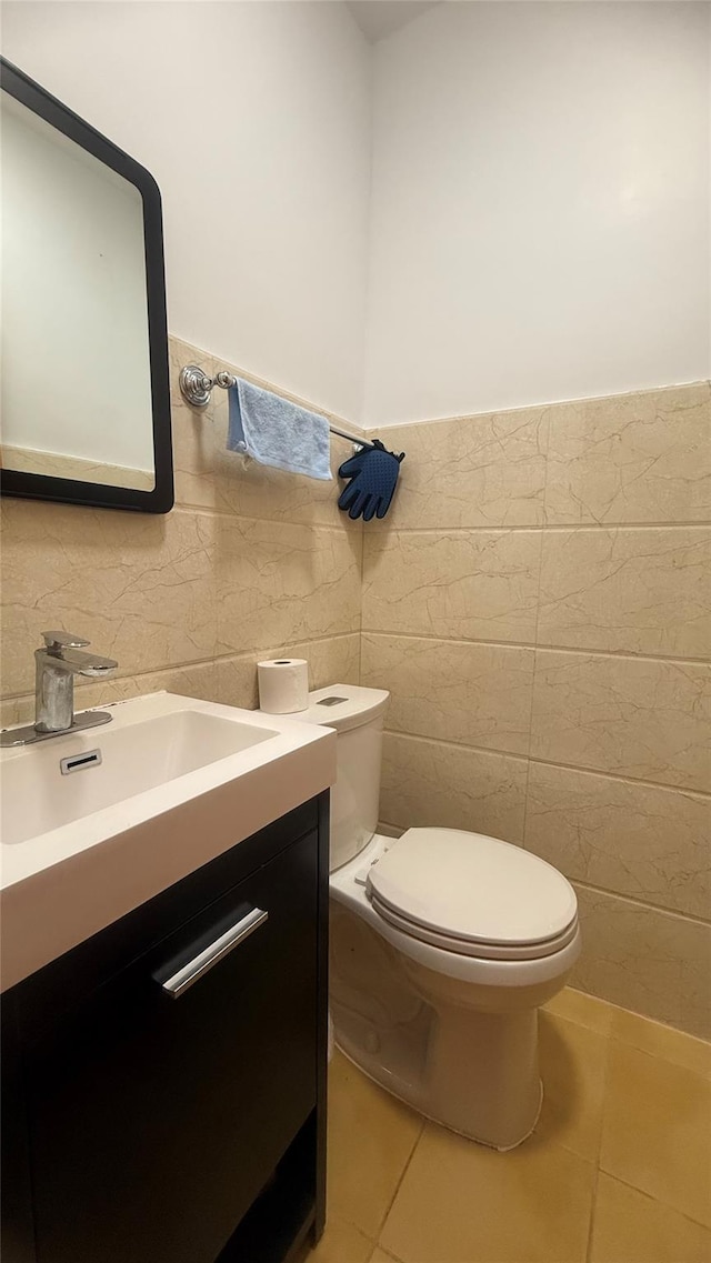 154-6 64th Ave, Flushing, NY 11367 - half bath featuring tile walls, tile patterned flooring, vanity, toilet, and a wainscoted wall