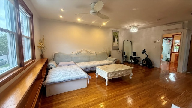 154-6 64th Ave, Flushing, NY 11367 - living room featuring a wall mounted AC, ceiling fan, wood finished floors, and ornamental molding