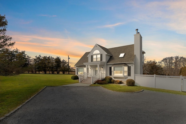 5 Ponds Rd, Water Mill, NY 11976 - view of front of home featuring roof with shingles, a chimney, and covered porch