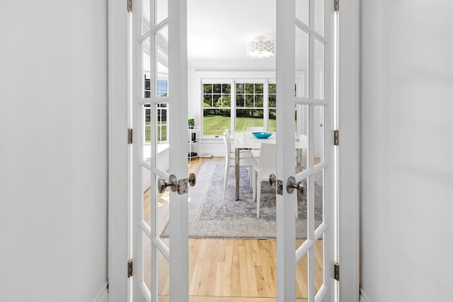 5 Ponds Rd, Water Mill, NY 11976 - doorway to outside with french doors and wood finished floors