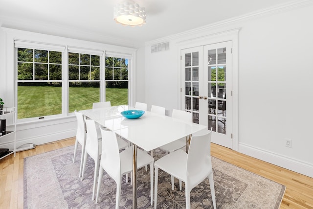 5 Ponds Rd, Water Mill, NY 11976 - dining area featuring french doors, ornamental molding, light wood-type flooring, and baseboards