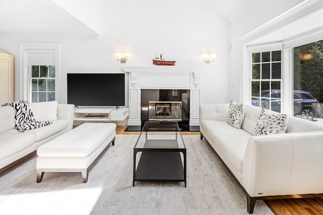 5 Ponds Rd, Water Mill, NY 11976 - living room with wood finished floors, vaulted ceiling, and a fireplace with flush hearth