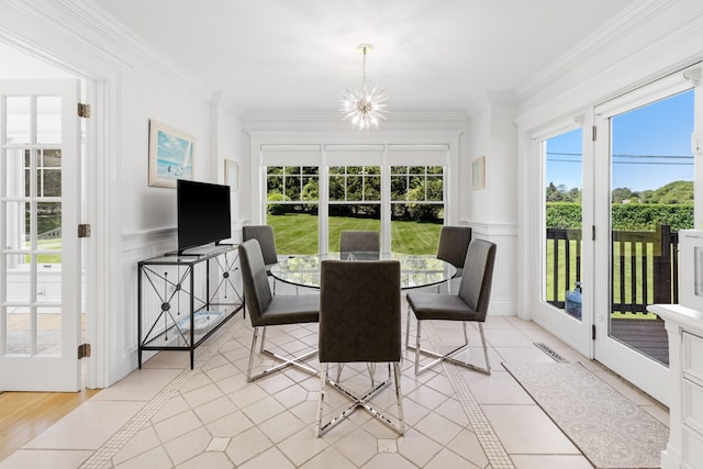 5 Ponds Rd, Water Mill, NY 11976 - dining area featuring a chandelier, light tile patterned flooring, ornamental molding, and wainscoting