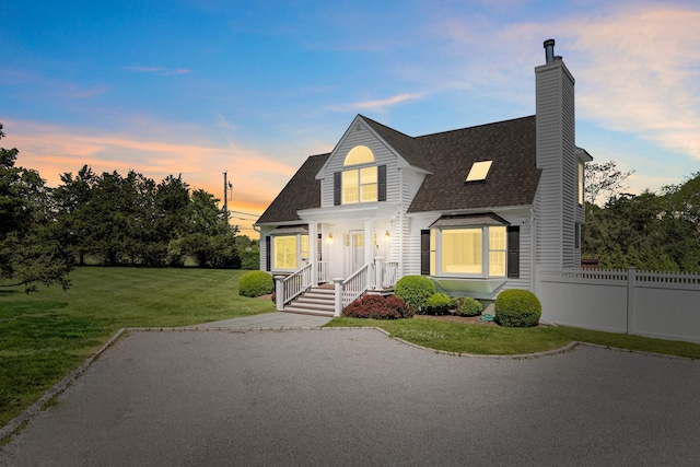 5 Ponds Rd, Water Mill, NY 11976 - view of front facade with a shingled roof and a chimney