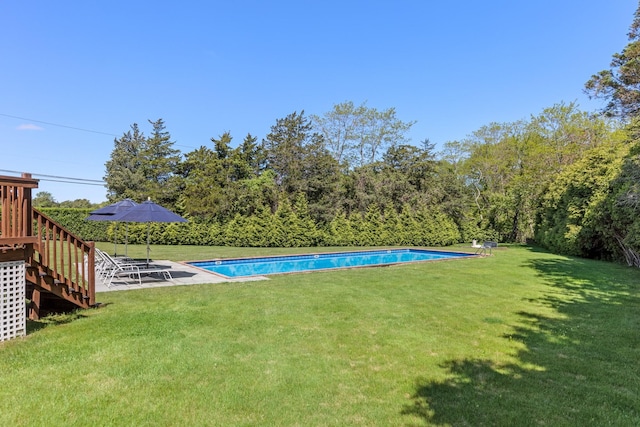 5 Ponds Rd, Water Mill, NY 11976 - view of green lawn with stairway and an outdoor pool