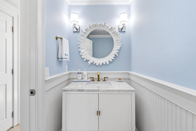 5 Ponds Rd, Water Mill, NY 11976 - bathroom featuring a wainscoted wall, vanity, and ornamental molding