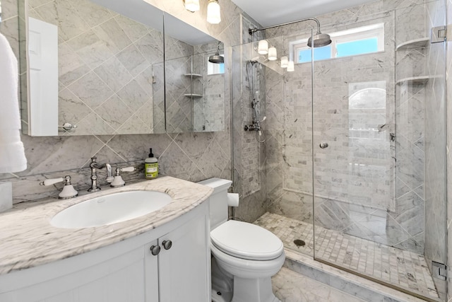 5 Ponds Rd, Water Mill, NY 11976 - full bathroom featuring vanity, a stall shower, toilet, and tile walls