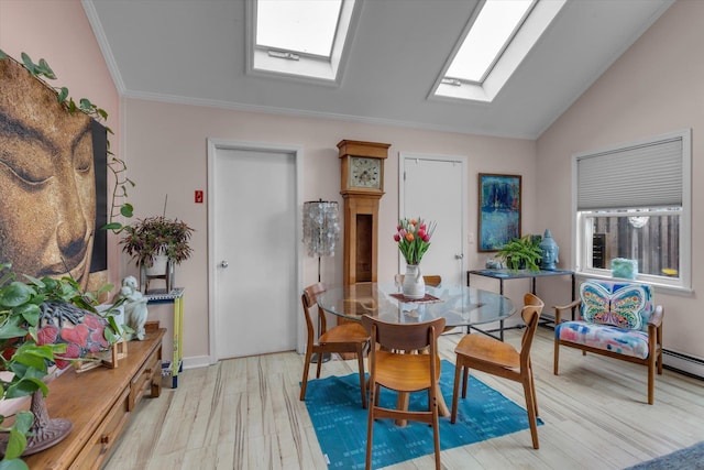 3 Makamah Beach Rd, Northport, NY 11768 - dining area with a skylight, lofted ceiling, light wood-style floors, crown molding, and plenty of natural light